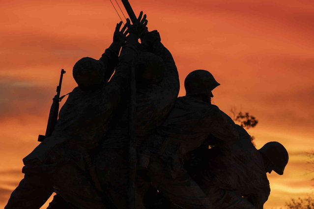 The Marine Corps War Memorial, also known as the Iwo Jima Memorial, is pictured on it's 70th anniversary during sunrise in Arlington, Va., Sunday, November 10, 2024. The memorial featuring statues of the six servicemen who raised the U.S. flag on Mount Suribachi during the Battle of Iwo Jima on Feb. 23, 1945, during World War II. (Photo by Jose Luis Magana/AP Photo)