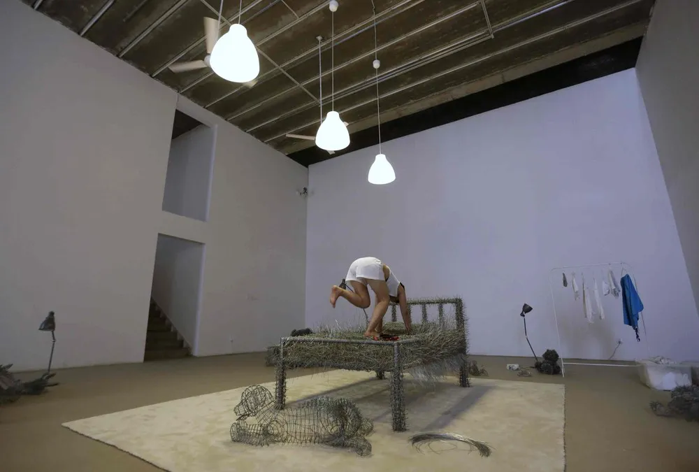 Chinese Artist Sleeps on a Iron Wire Bed