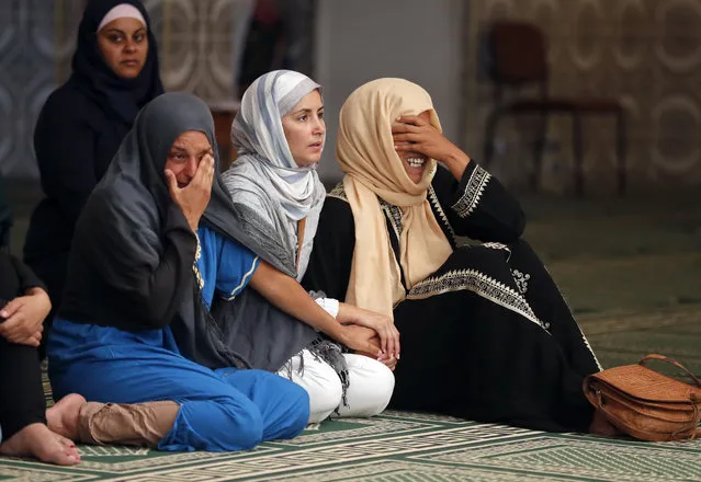 Relatives of 4 year old Kylan Mejri who was killed in Thursday's truck attack, cry at the ar-Rahma mosque in the eastern Nice suburb of Ariane, Tuesday, July 19, 2016. Kylan's mother Olfa Kalfallah, 31, was also killed. (Photo by Francois Mori/AP Photo)