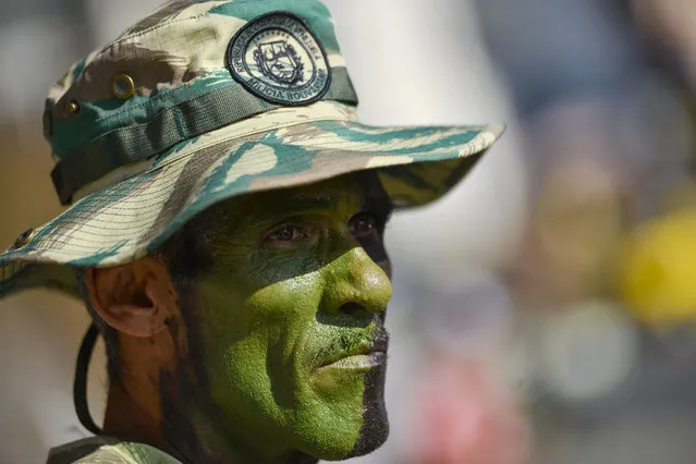 A member of the Bolivarian National Militia takes part in an invasion drill in Caracas, Venezuela, Saturday, February 15, 2020. (Photo by Matias Delacroix/AP Photo)