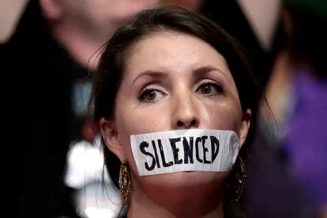 Wisconsin delegate Angie Aker wears tape covering her mouth labeled “silence” during the first day of the Democratic National Convention at the Wells Fargo Center, July 25, 2016 in Philadelphia, Pennsylvania. An estimated 50,000 people are expected in Philadelphia, including hundreds of protesters and members of the media. The four-day Democratic National Convention kicked off July 25. (Photo by Drew Angerer/Getty Images)