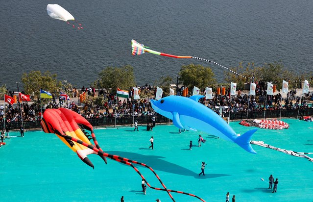 Kite enthusiasts fly kites during the International Kite Festival in Ahmedabad, India, on January 12, 2025. (Photo by Amit Dave/Reuters)