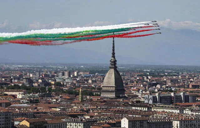 The Frecce Tricolori (Tricolor Arrows) aerobatic squad of the Italian Air Force fly over Turin, northern Italy, Monday, May 25, 2020, as part of the celebrations for the 74th anniversary of the Italian Republic born on June 2, 1946. This year the acrobatic squad will fly over several Italian cities to bring a message of unity and solidarity during the coronavirus pandemic. (Photo by Marco Alpozzi/LaPresse via AP Photo)