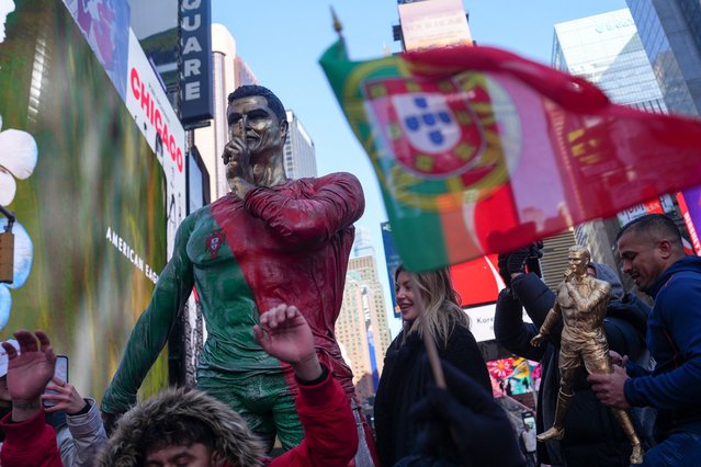 People gather for a statue unveiling in Times Square on the birthday of soccer star Cristiano Ronaldo in New York City, U.S., February 5, 2025. (Photo by David 'Dee' Delgado/Reuters)