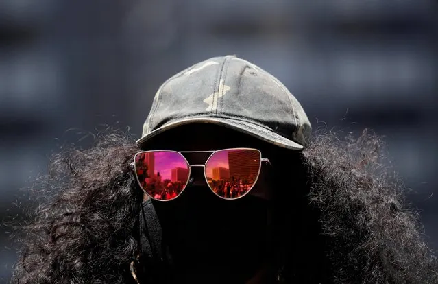 Tiffany Simms wears a protective mask and sunglasses as she attends a protest against racial inequality in the aftermath of the death in Minneapolis police custody of George Floyd in Los Angeles, California, U.S. June 8, 2020. (Photo by Mike Blake/Reuters)