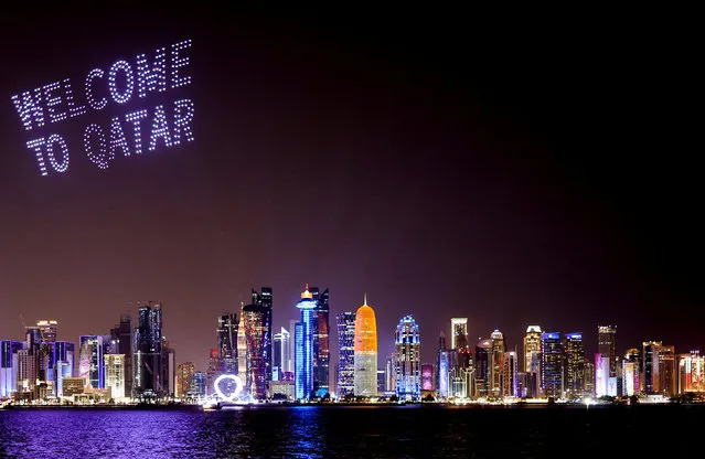 A drone show with welcoming words is seen above the Doha skyline, ahead of the FIFA World Cup 2022 soccer tournament in Doha, Qatar on November 14, 2022. (Photo by Amr Abdallah Dalsh/Reuters)