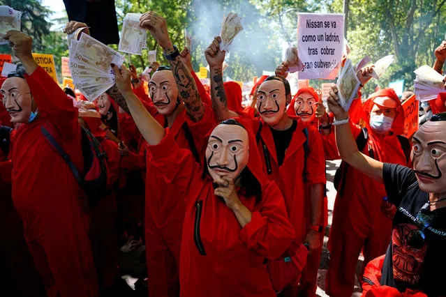 Nissan workers dressed in costumes from “La Casa de Papel (Money Heist)” take part in a protest outside Spanish parliament in Madrid, Spain, July 15, 2020. (Photo by Juan Medina/Reuters)