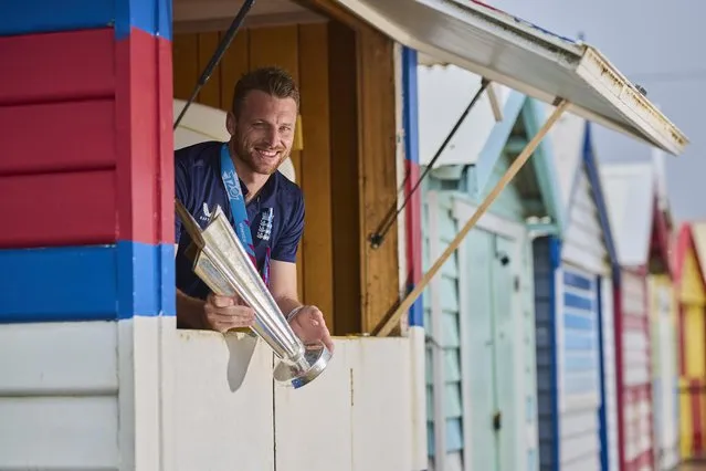 In this handout provided by the International Cricket Council, Jos Buttler the captain of England poses with the T20 World Cup Trophy after England won the ICC Men's T20 World Cup Final, at Brighton Beach on November 14, 2022 in Melbourne, Australia. (Photo by Graham Denholm-ICC/ICC via Getty Images)