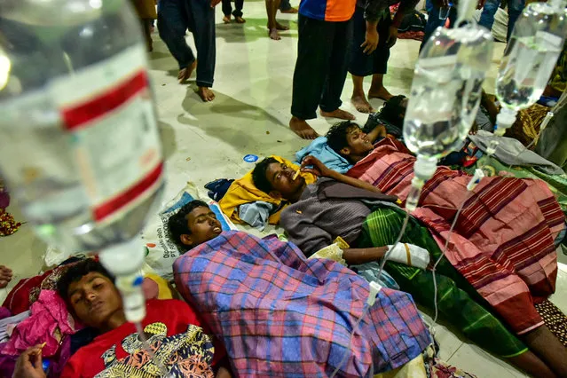 Rohingya refugees receive medical treatment after their arrival at the temporary shelter in Pidie, Aceh province, Indonesia on December 26, 2022, in this photo taken by Antara Foto. (Photo by Joni Saputra/Antara Foto via Reuters)