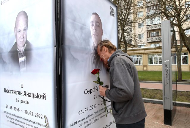 A man cries at a banner with a photograph of one of the perished heroes who had been defending Ukraine's Independence since 2014 situated in the central square of Irpin as seen on the second anniversary since the liberation of the city from Russian invaders in Irpin, Kyiv Region, northern Ukraine on March 28, 2024. (Photo by Ukrinform/Rex Features/Shutterstock)