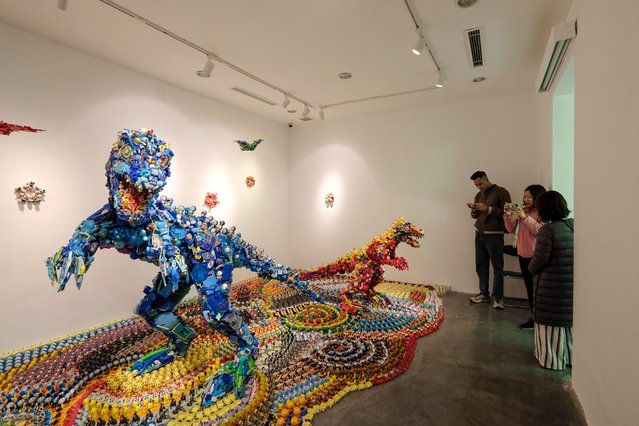 People visit the “Plastic Dinoland” exhibition by Japanese artist Hiroshi Fuji, in Hanoi, Vietnam, 17 March 2025. The exhibition, which features colorful installations of dinosaurs made from discarded toys, runs from 15 March to 01 June 2025 at The Japan Foundation in Hanoi. (Photo by Luong Thai Linh/EPA/EFE)