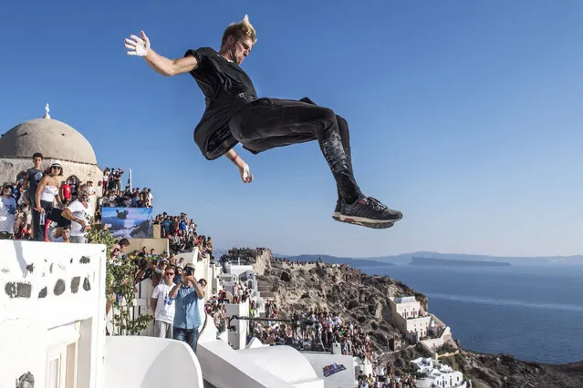 A handout photograph made available on 02 October 2016 by Global Newsroom showing Alfred Scott of the United States performs during the finals at the Red Bull Art of Motion on Santorini Island, Greece on 01 October 2016. The event was won by Bart van der Linden of the Netherlands, followed by Alfred Scott and Joey Adrian both of the United States. (Photo by Predrag Vukovic/EPA/Global Newsroom)