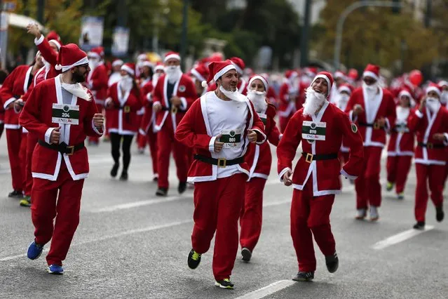 People dressed in Santa costumes take part in the Santa Claus Run in Athens December 7, 2014. (Photo by Alkis Konstantinidis/Reuters)