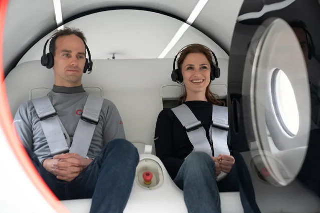 Virgin Hyperloop executives Josh Giegel, its Chief Technology Officer, and Sara Luchian, Director of Passenger Experience are seen inside a Virgin Hyperloop pod during testing at their DevLoop test site in Las Vegas, Nevada, in this November 8, 2020 handout image released by Virgin Hyperloop. (Photo by VIRGIN HYPERLOOP/Handout via Reuters)