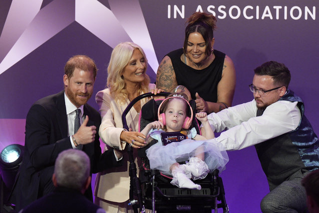 Prince Harry, Duke of Sussex, and Gaby Roslin present the Inspirational Child 4-6 award to six-year-old Esmee Mcglinchey, at the annual WellChild Awards 2025, which celebrates the achievements and resilience of seriously ill youngsters and their families, at the Royal Lancaster Hotel in London, Britain on September 8, 2025. (Photo by Aaron Chown/Pool via Reuters)