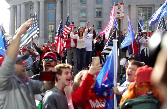 Supporters of U.S. President Donald Trump cheer alongside the presidential motorcade at Freedom Plaza near the White House in Washington, U.S. November 14, 2020. (Photo by Tom Brenner/Reuters)