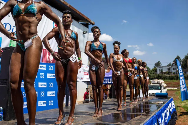 Bodybuilders pose on stage during the Iron Fit Bodybuilding competition in Nairobi on December 05, 2020. 130 participants from all across East Africa took part in the second edition of this competition which included categories like Bikini, Figure, Physique and Bodybuilding. (Photo by Patrick Meinhardt/AFP Photo)