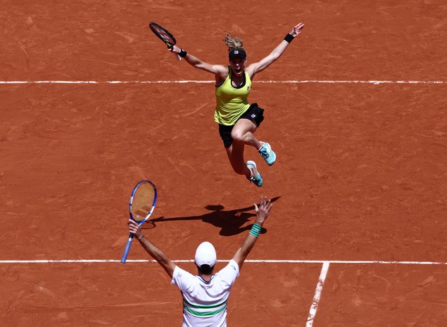 Germany's Laura Siegemund celebrates with France's Edouard Roger-Vasselin after winning the mixed doubles final against Britain's Neal Skupski and Desirae Krawczyk of the U.S. at the French Open in Paris on June 6, 2024. (Photo by Yves Herman/Reuters)