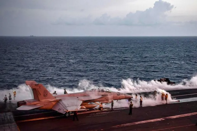 A F18-C Hornet fighter jet waits to take off from the deck of the 330 meters US navy aircraft carrier the USS Harry S. Truman in the eastern Mediterranean Sea on May 8, 2018. The USS Harry S. Truman Carrier Strike Group on May 3 began air operations in support of Operation Inherent Resolve, conducting flight operations against the so called Islamic State (IS) targets in Syria and Iraq. The strike group includes a guided-missile cruiser and four guided-missile destroyers. (Photo by Aris Messinis/AFP Photo)
