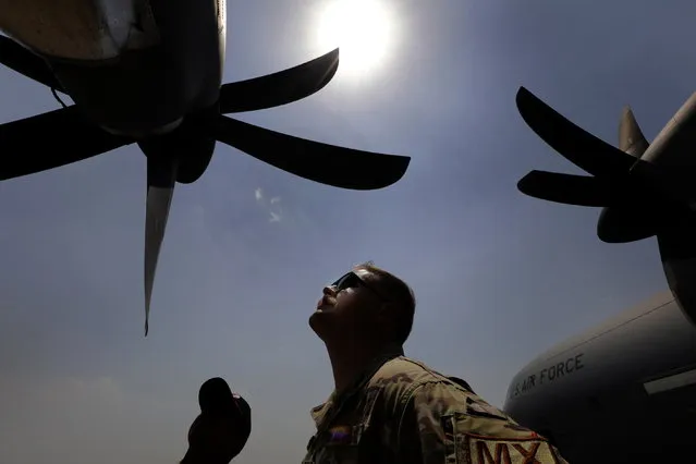 US Air force pilots perform ground exercise next to the fighter planes during the joint India-US military exercise “Cope India 2023” at Panagarh Air Base, far west of Kolkata, 20 April 2023. “Cope India 2023” is a bilateral Air exercise between the Indian and US Air Forces and takes place between 10 to 23 April 2023. (Photo by Piyal Adhikary/EPA)