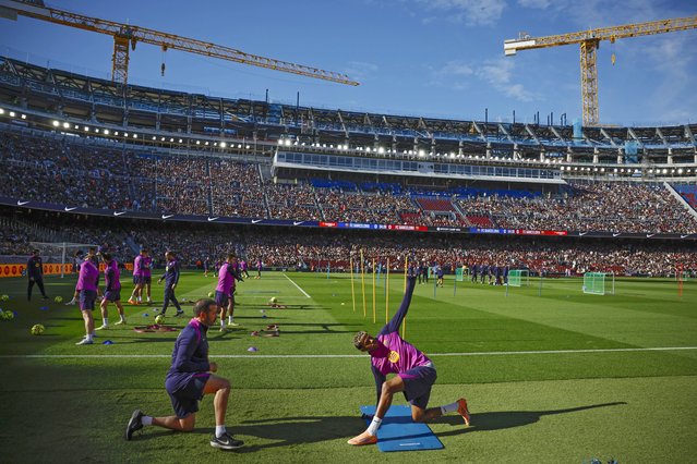 FC Barcelona's Lamine Yamal during a public training session of FC Barcelona at the remodeled Camp Nou stadium in Barcelona, Spain, 07 November 2025. Some 23,000 people bought tickets to the open training session of FC Barcelona, the first time opening the stadium since modernization works began in 2023. (Photo by Alberto Estevez/EPA)