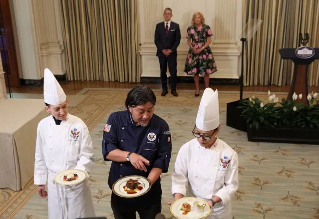 Chef Edward Lee, and White House chefs Cris Comerford and Susie Morrison display food during a media preview hosted by U.S. first lady Jill Biden ahead of a White House State Dinner for South Korean President Yoon Suk Yeol and his wife Kim Keon Hee in the State Dining Room at the White House in Washington, U.S., April 24, 2023. (Photo by Leah Millis/Reuters)