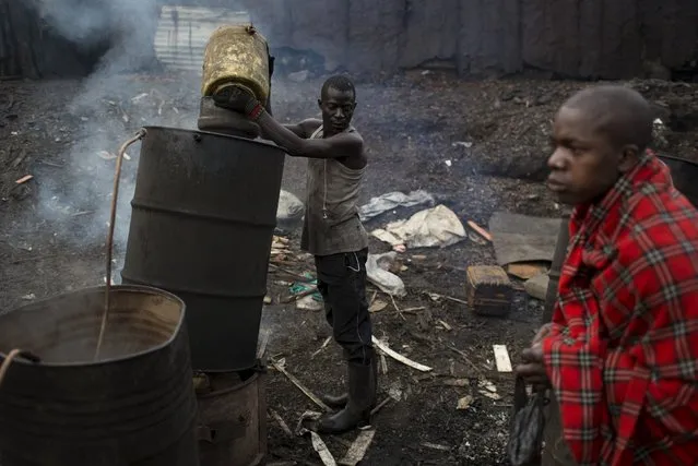 Men distil a local home-brew alcoholic drink called Chang'aa in Mathare in Nairobi, Kenya, November 17, 2015. (Photo by Siegfried Modola/Reuters)