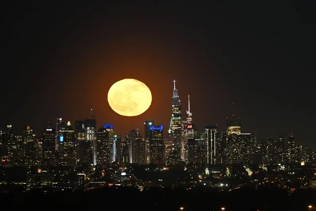 The Full Flower Moon rises above Midtown Manhattan during night time in New York City, United States on May 6, 2023. (Photo by Lokman Vural Elibol/Anadolu Agency via Getty Images)