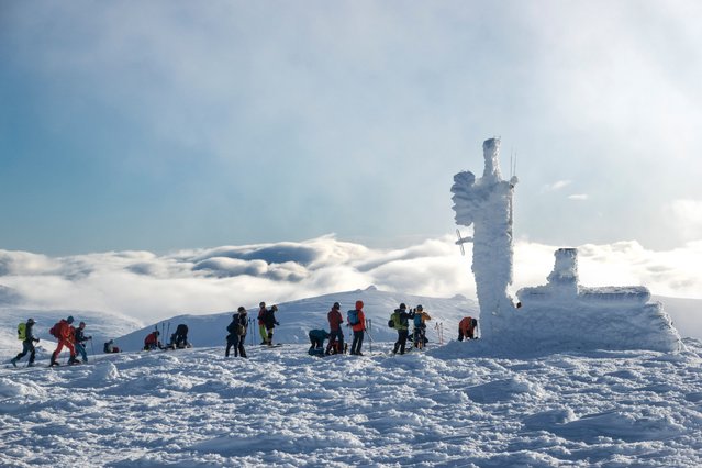 Walkers and skiers enjoy snowy weather on the summit of Cairn Gorm in Highlands, ScotlandNovember 23, 2025. (Photo by Murdo MacLeod/The Guardian)