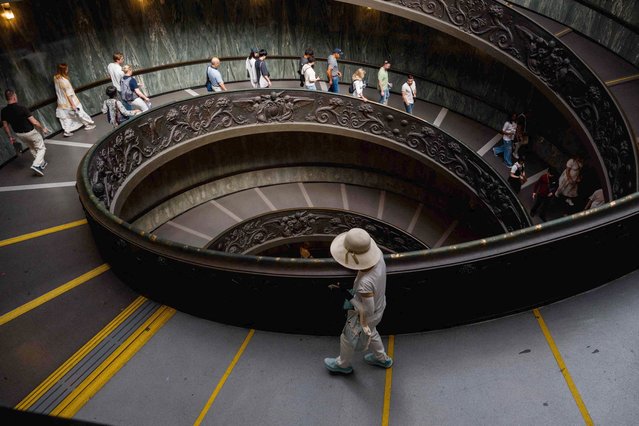 Visitors walk down the Bramante Staircase at The Vatican Museums, during a press tour at the Vatican on May 2, 2025. (Photo by Dimitar Dilkoff/AFP Photo)