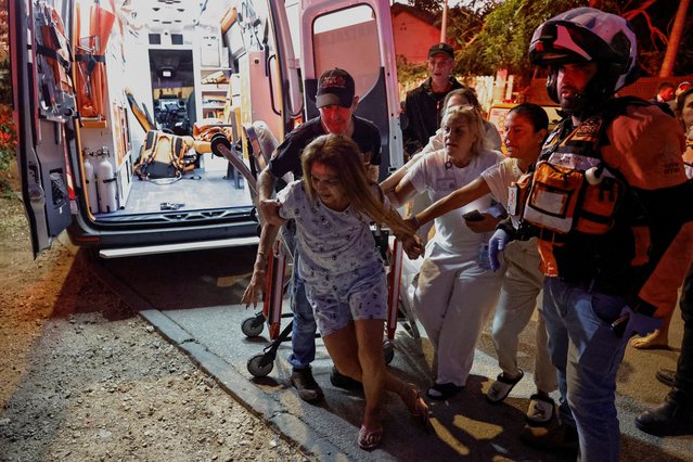 A woman reacts in distress at the impact site in the aftermath of a fatal direct hit, following a barrage of projectiles fired from Lebanon, In Nahariya, northern Israel on November 12, 2024. (Photo by Thomas Peter/Reuters)