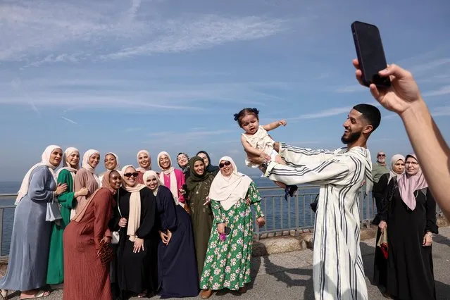 People take a picture as Muslim faithfuls celebrate the Eid al-Adha festival, in New York City, New York, U.S., June 28, 2023. (Photo by Amr Alfiky/Reuters)