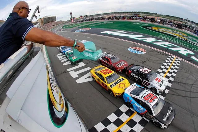 Aric Almirola, driver of the #10 Smithfield/IHOP Ford, leads the field to the green flag to start the NASCAR Cup Series Quaker State 400 Available at Walmart at Atlanta Motor Speedway on July 09, 2023 in Hampton, Georgia. (Photo by Alex Slitz/Getty Images/AFP Photo)
