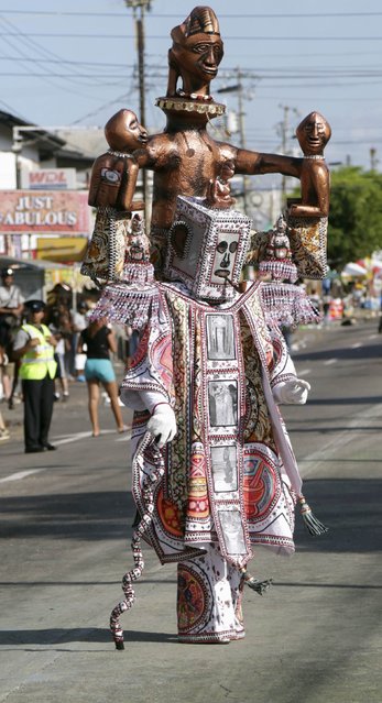 A reveller from the band “21st Anniversary In Retrospect” by Belmont Exotic Stylish Sailors, performs during Carnival Monday in Woodbrook, Port of Spain February 16, 2015. (Photo by Andrea De Silva/Reuters)