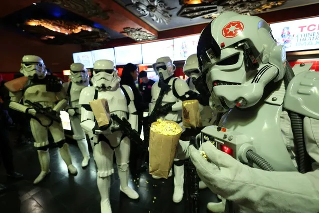 People wearing stormtrooper costumes eat popcorn at a special screening of “Star Wars: Episode V – The Empire Strikes Back” to benefit the Will Rogers Motion Picture Pioneers Foundation at TCL Chinese Theatre in Los Angeles, California, U.S., August 30, 2023. (Photo by Mario Anzuoni/Reuters)
