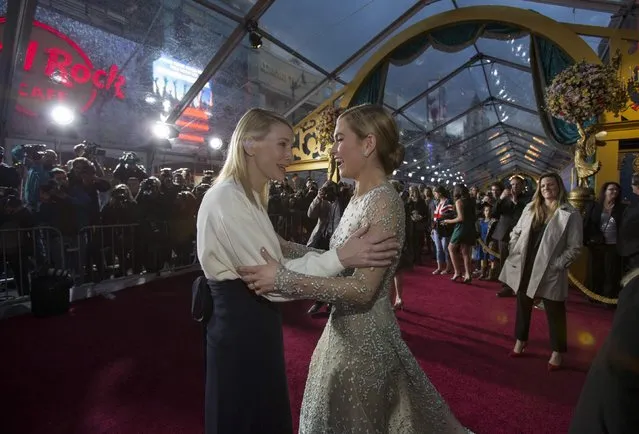 Cast members Cate Blanchett (L) and Lily James greet each other at the premiere of "Cinderella" at El Capitan theatre in Hollywood, California March 1, 2015. The movie opens in the U.S. on March 13. REUTERS/Mario Anzuoni  (UNITED STATES - Tags: ENTERTAINMENT)