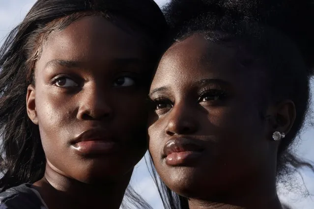 Bethel Boateng and her sister Natalie Boateng pose for a portrait along Pena Boulevard nearly a year after they and other youth led a march onto the highway in protest of the killing of George Floyd in Denver, Colorado, U.S., May 20, 2021. (Photo by Kevin Mohatt/Reuters)
