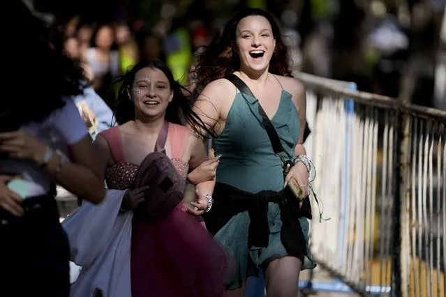 Fans make their way to the Monumental stadium to attend Taylor Swift: The Eras Tour concert, in Buenos Aires, Argentina, Thursday, November 9, 2023. (Photo by Natacha Pisarenko/AP Photo)