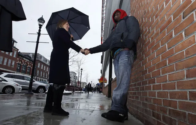 US Sen. Kirsten Gillibrand, D-NY, shakes hands with Eric Tembas, originally from Somalia, while touring Main Street in Concord, N.H., Friday, February 15, 2019. Gillibrand visited New Hampshire as she explores a 2020 run for president. (Photo by Charles Krupa/AP Photo)