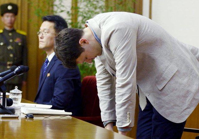 Otto Frederick Warmbier (R), a University of Virginia student who has been detained in North Korea since early January, bows during a new conference in Pyongyang, North Korea, in this photo released by Kyodo February 29, 2016. Warmbier was detained for trying to steal a propaganda slogan from his Pyongyang hotel and has confessed to “severe crimes” against the state, the North's official media said on Monday. Warmbier, 21, was detained before boarding his flight to China over an unspecified incident at his hotel, his tour agency told Reuters in January. (Photo by Reuters/Kyodo News)