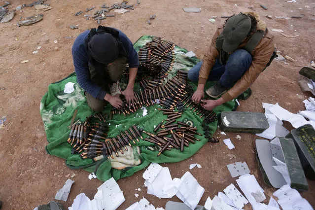 Rebel fighters arrange shells on the outskirts of the northern Syrian town of al-Bab, Syria January 26, 2017. (Photo by Khalil Ashawi/Reuters)