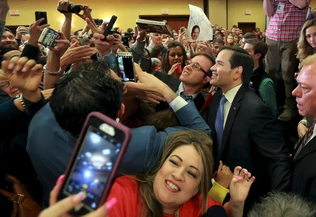 U.S. Republican presidential candidate Marco Rubio takes selfies with supporters after speaking at a campaign rally in Houston, Texas February 24, 2016. (Photo by Richard Carson/Reuters)