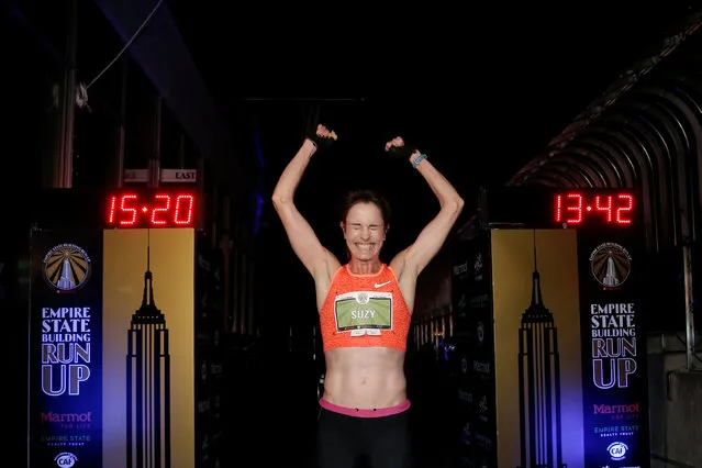 Suzy Walsham of Australia celebrates at the finish line on the 86th floor observation deck after running up the 86 flights, 1,576 stairs of the Empire State Building to win the women's division of the 2017 “Empire State Building Run-up” running race in New York, February 1, 2017. (Photo by Mike Segar/Reuters)