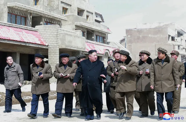 This undated picture released by North Korea's official Korean Central News Agency (KCNA) on April 4, 2019 shows North Korean leader Kim Jong-Un (C) inspecting Samjiyon County. (Photo by KCNA via KNS/AFP Photo)