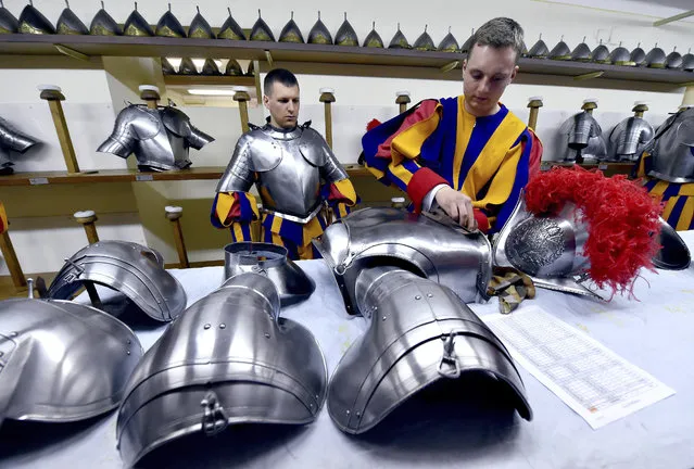 New Vatican Swiss Guards wear their uniforms and armors prior to a swearing-in ceremony, at the Vatican, Wednesday, May 6, 2015. (Photo by Ettore Ferrari/AP Photo/Pool Photo)