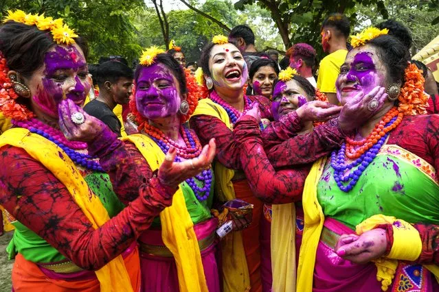 Women put coloured powder to each other as they celebrate Holi, the festival of colors, in Kolkata, India, Monday, March 25, 2024. The festival heralds the arrival of spring. (Photo by Bikas Das/AP Photo)