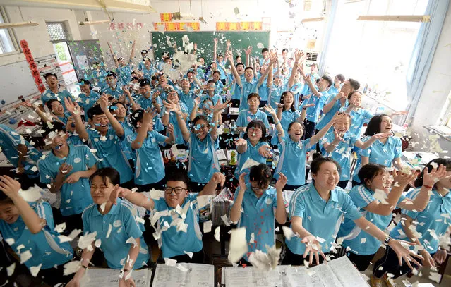 Pupils celebrate their third year of high school in Hebei province, Handan, China on May 27, 2019. (Photo by Costfoto/Barcroft Media)