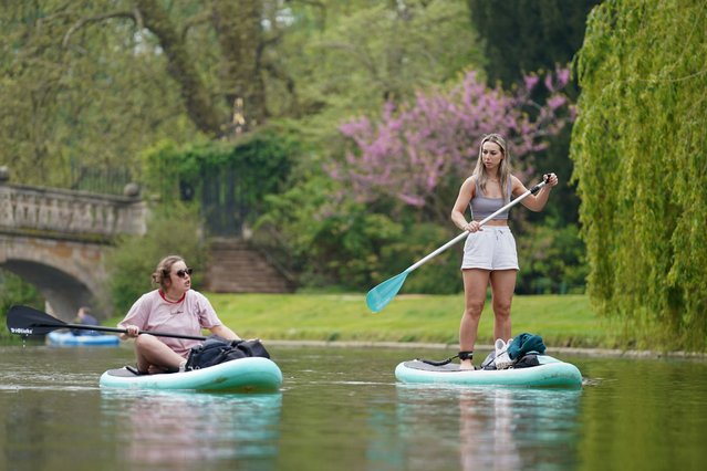 People paddleboard along the River Cam in Cambridge on Thursday, May 02, 2024. (Photo by Joe Giddens/PA Images via Getty Images)