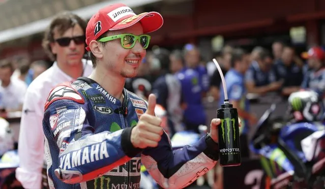 Yamaha's Jorge Lorenzo gestures after clocking the third fastest time for Sunday's Spanish Motorcycling in Montmelo, Spain, Saturday, June 13, 2015. The Catalunya Grand Prix will take place on Sunday in Montmelo. (AP Photo/Manu Fernandez)