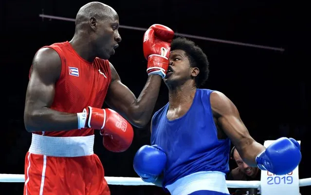 Cuba's Erislandy Savon (L) and Ecuador's Julio Cesar Castillo compete during the Men's Heavy (91kg) Finals Bout of the Boxing competition of the Lima 2019 Pan-American Games at the Miguel Grau Coliseum in Callao on August 2, 2019. (Photo by Cris Bouroncle/AFP Photo)